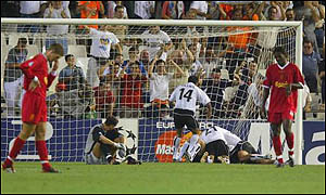 Liverpool players are dejected as Valencia go ahead