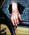 Thief breaking into vehicle