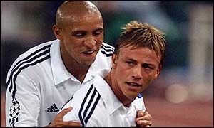 Roberto Carlos congratulates Guti on his second goal against Roma