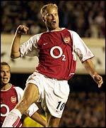 Arsenal's Dennis Bergkamp celebrates his opener