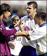 Juan Pablo Angel of Aston Villa is grabbed by Dennis Wise.