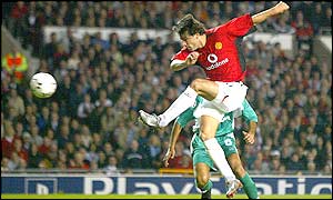 Van Nistelrooy leaves the Haifa defence stranded as he powers home United's fourth goal