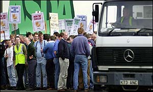 Protesters make their point outside the Asda depot