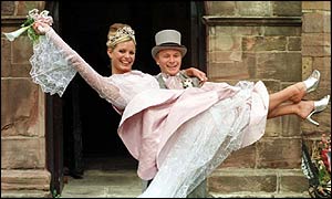 Ashley holds Tracy Shaw as Maxine in their wedding scene