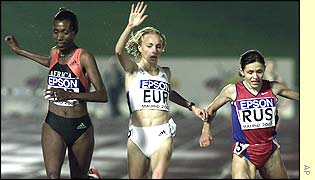 Berhane Adere of Africa beats Europe's Gabriela Szabo in the 3,000m