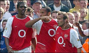 Arsenal goalscorer Thierry Henry embraces Freddie Ljungberg, who's pass let Henry in
