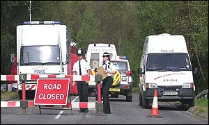 Police road block at the site near Yateley Heath, Minley, near Fleet in Hampshire