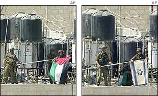 Israeli troops exchange a Palestinian flag for an Israeli one