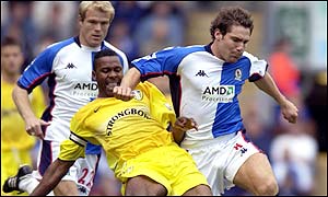 Lucas Radebe challenges David Dunn