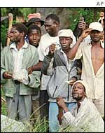 'War veterans' outside a white-owned farm in Zimbabwe