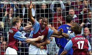 Dion Dublin is mobbed after Aston Villa's winner