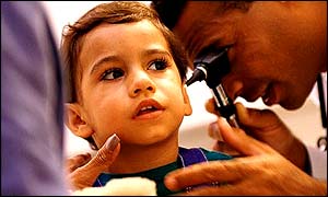 Child receives examination from doctor