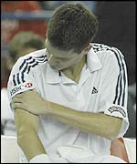 Tim Henman feels his injured shoulder