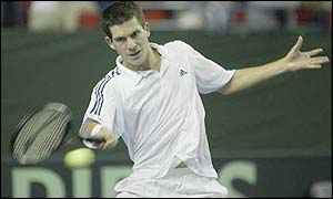 Tim Henman hits a forehand