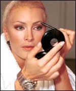 Woman applying make-up