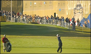 America's David Duval plays his second shot to the first green 