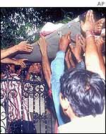 Injured person carried to safety