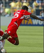 Jaidi falls under a tackle from Russia's Pimenkov