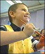 Boy at nursery painting
