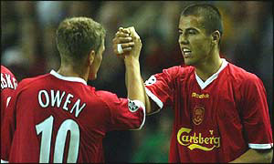 Baros is congratulated by Owen after Liverpool's goal