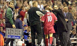 Michael Owen is comforted by the Liverpool bench after being replaced by Patrick Berger in the second half