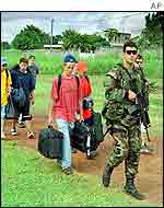 French soldier escorts American children to safety