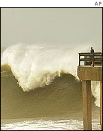 Wave pounds Gulf State Pier, in Gulf Shores, Alabama