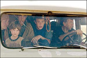 A family in their car flees from their village of Galashki. AFP