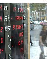 A cyclist passes by a brokerage house in Tokyo on Tuesday