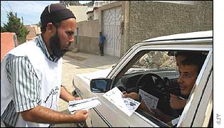 Member of fundamentalist Justice and Development Party (PJD) hands out leaflets