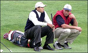 Tiger Woods reflects after he and Mark Calcavecchia are beaten by Sergio Garcia and Lee Westwood