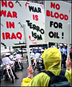 Sue Bastian carries anti-war placards