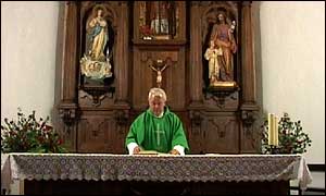 Father Larrinaga in church