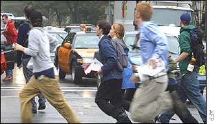 Protesters run on hearing police approach after disrupting traffic