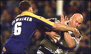 Leeds' Ben Walker tackles Graham Mackay of Hull