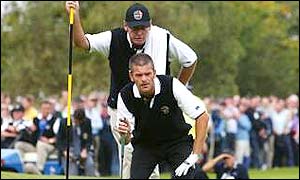 Jesper Parnevik with his caddie