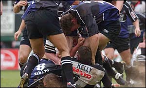 Ponty's Nick Kelly receives some rough treatment and was also yellow carded