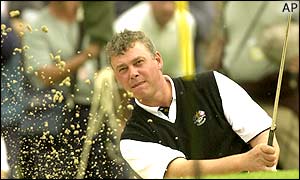 Darren Clarke hits his way out of a bunker at the fifth