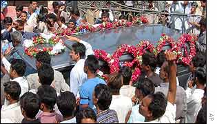 Mourners hold the coffin of one of Wednesday's victims