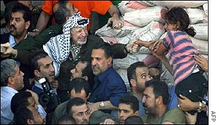 Yasser Arafat emerging from compound