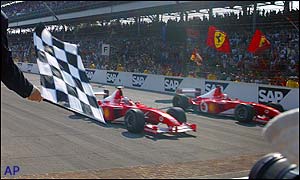 The Ferrari pair cross the finish line together