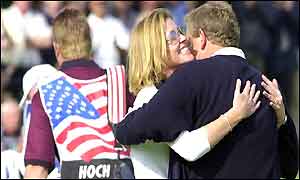 Colin Montgomerie hugs his wife Eimear after winning his singles match against USAs Scott Hoch