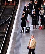 Commuters wait for delayed train