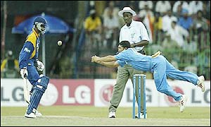 Tendulkar attempts a dramatic catch but drops the ball