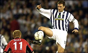 West Brom midfielder Sean Gregan controls the ball ahead of Blackburn winger Damien Duff