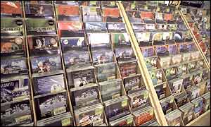 CDs lining the shelves in a music shop 