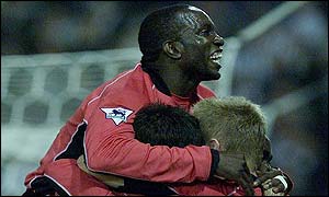 Dwight Yorke celebrates with his Blackburn team-mates