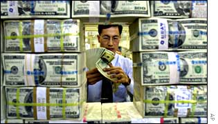 Counting banknotes at Korea Exchange Bank