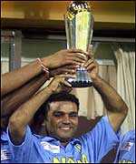 Virender Sehwag holds the trophy