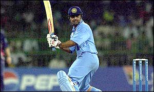 Virender Sehwag watches the ball fly to the boundary